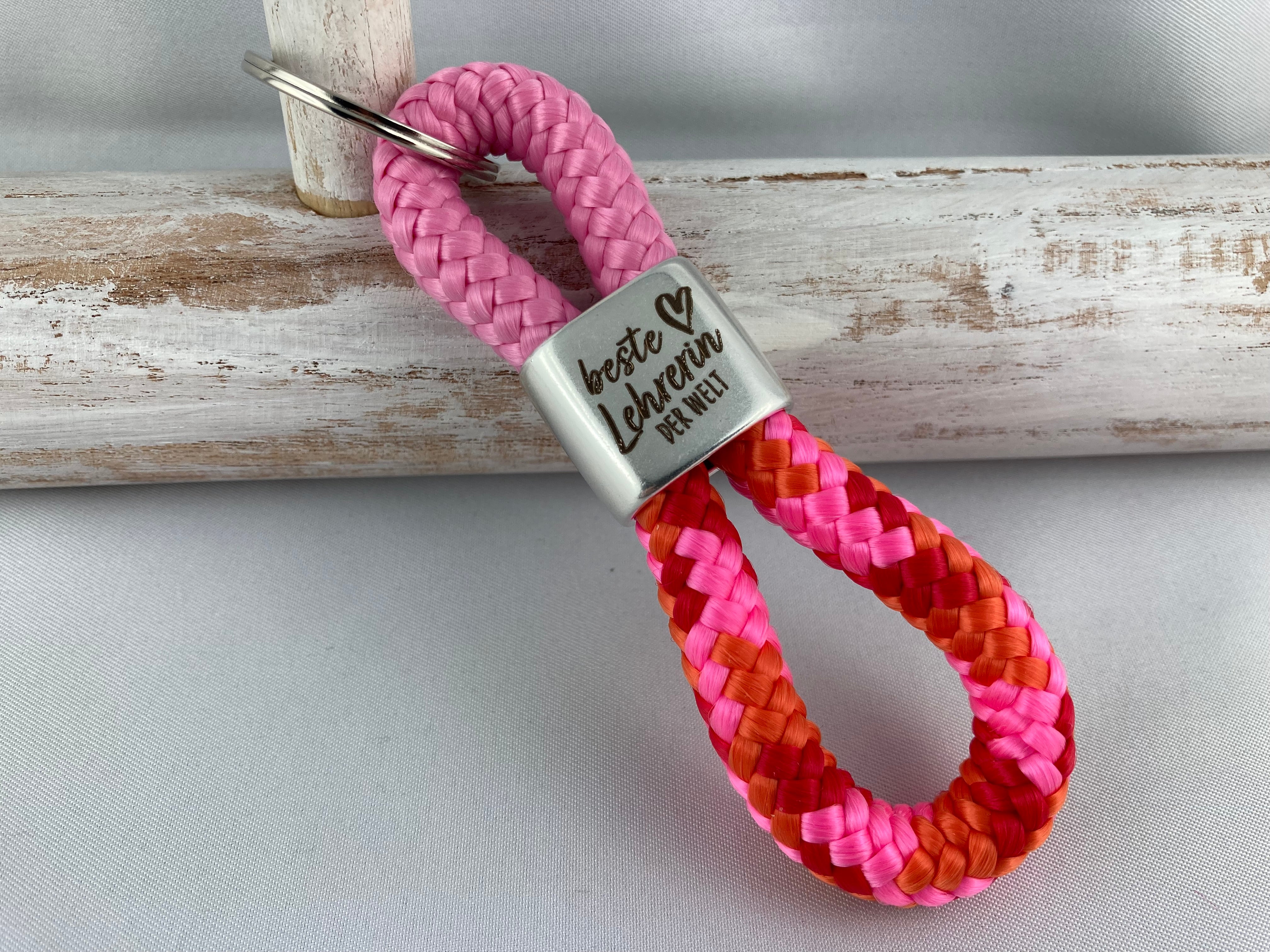 Schlüsselanhänger aus Segelseil mit versilbertem Zwischenstück mit Gravur "Beste Lehrerin der Welt" rosa/ orange-rosa-rot-mix