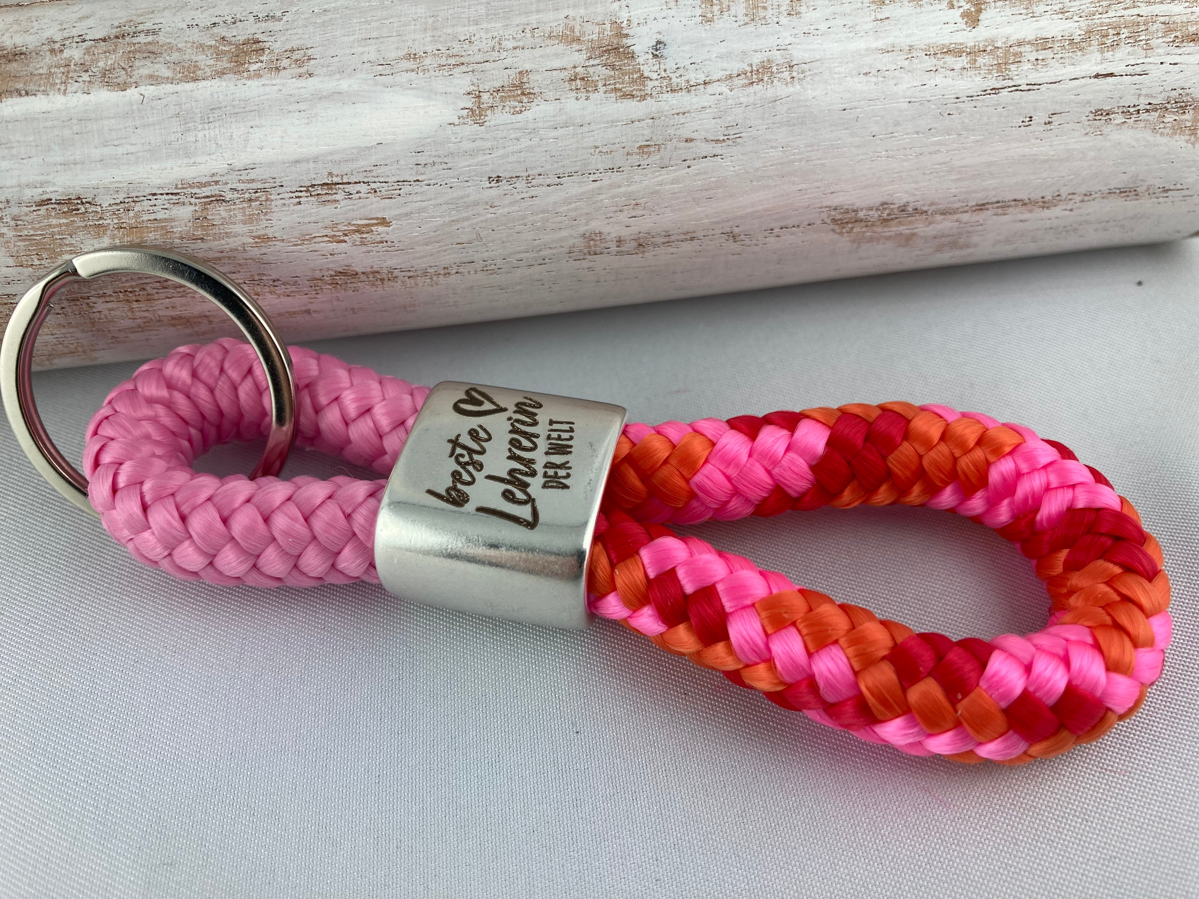 Schlüsselanhänger aus Segelseil mit versilbertem Zwischenstück mit Gravur "Beste Lehrerin der Welt" rosa/ orange-rosa-rot-mix