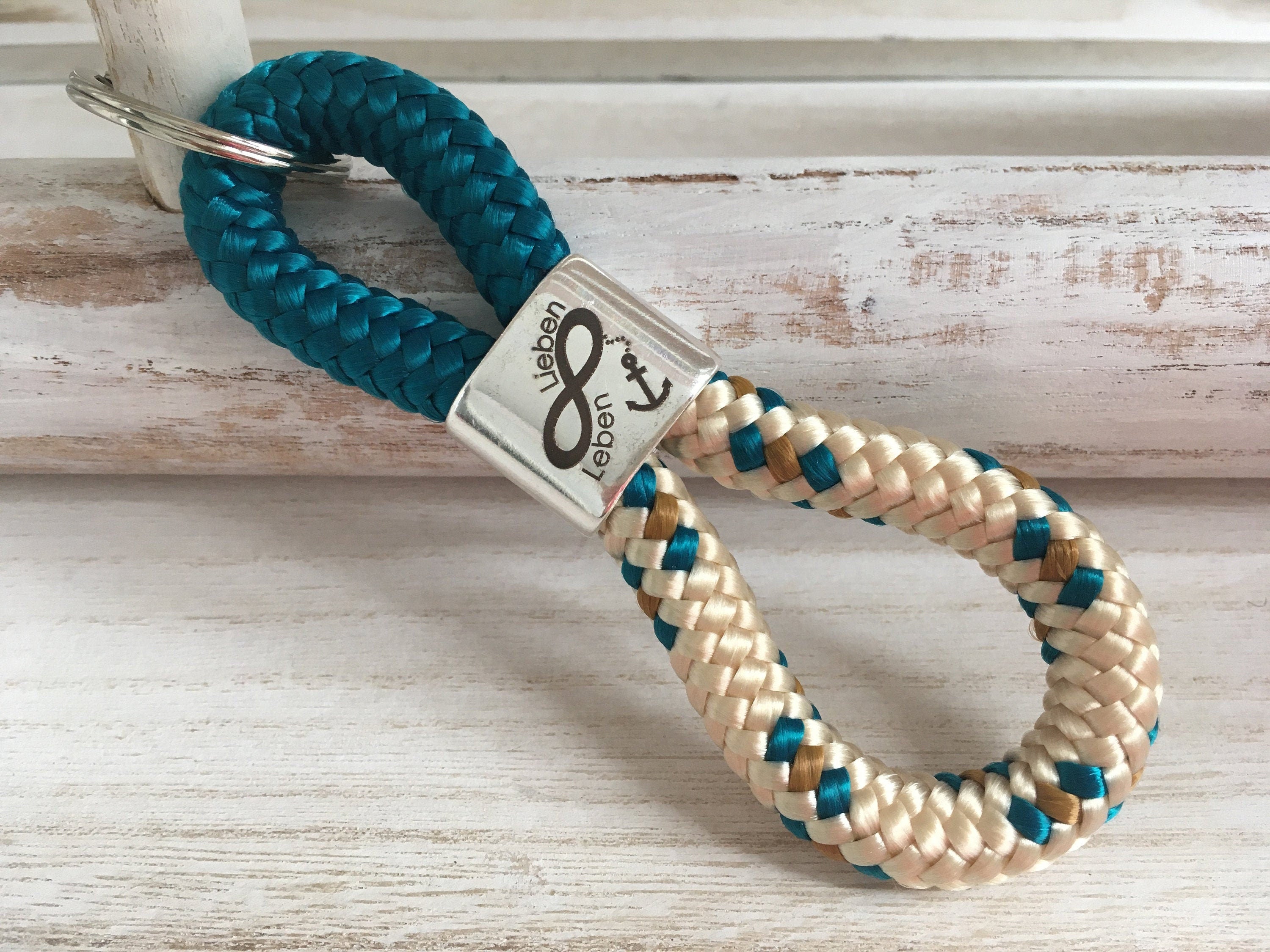 Schlüsselanhänger aus Segelseil mit versilbertem Zwischenstück mit Gravur "Unendlich Lieben, unendlich Leben", petrol/ beige-petrol-curry