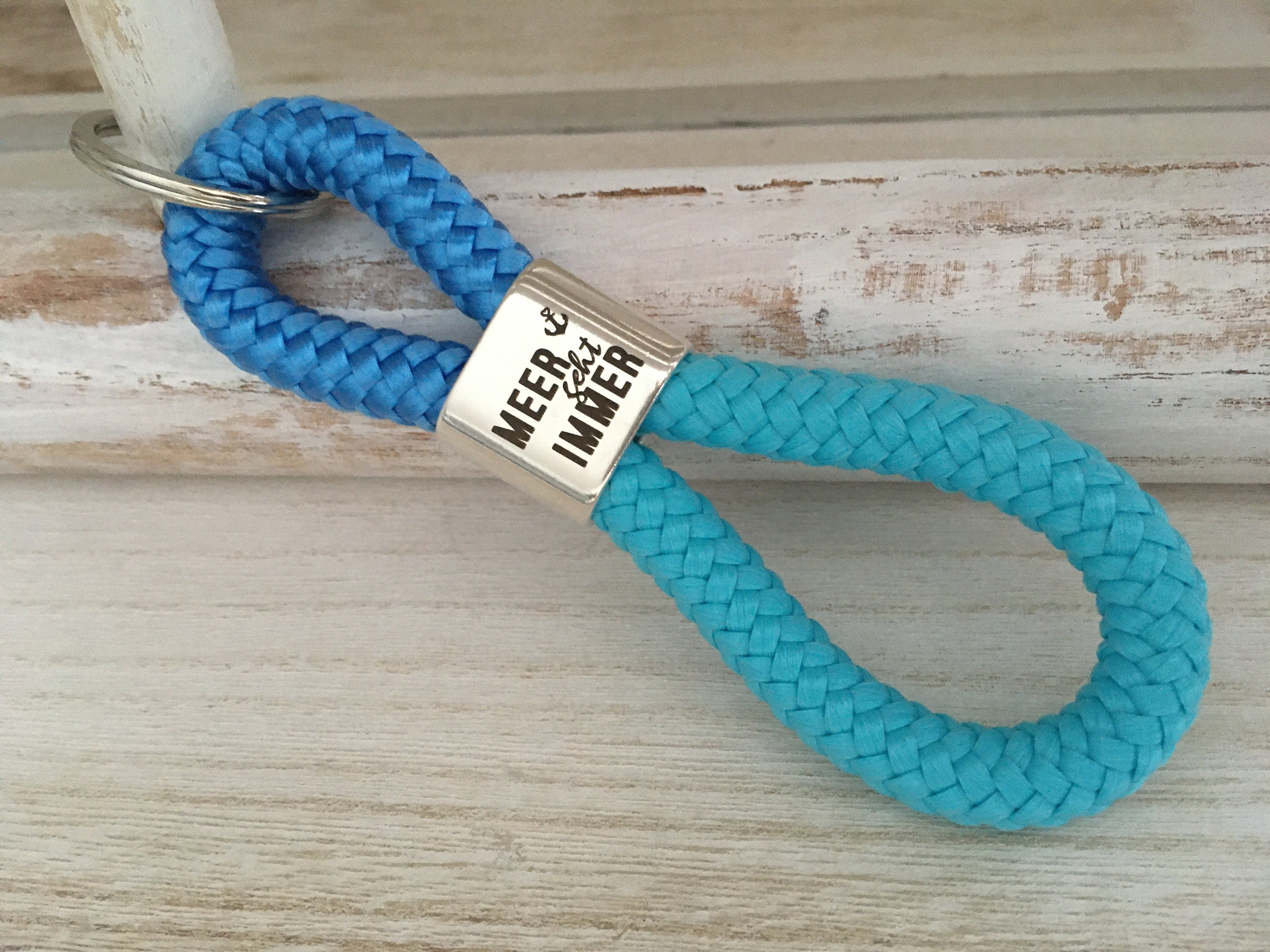Schlüsselanhänger aus Segelseil mit versilbertem Zwischenstück mit Gravur "Meer geht immer", maritimer Schlüsselanhänger, himmelblau/ türkis