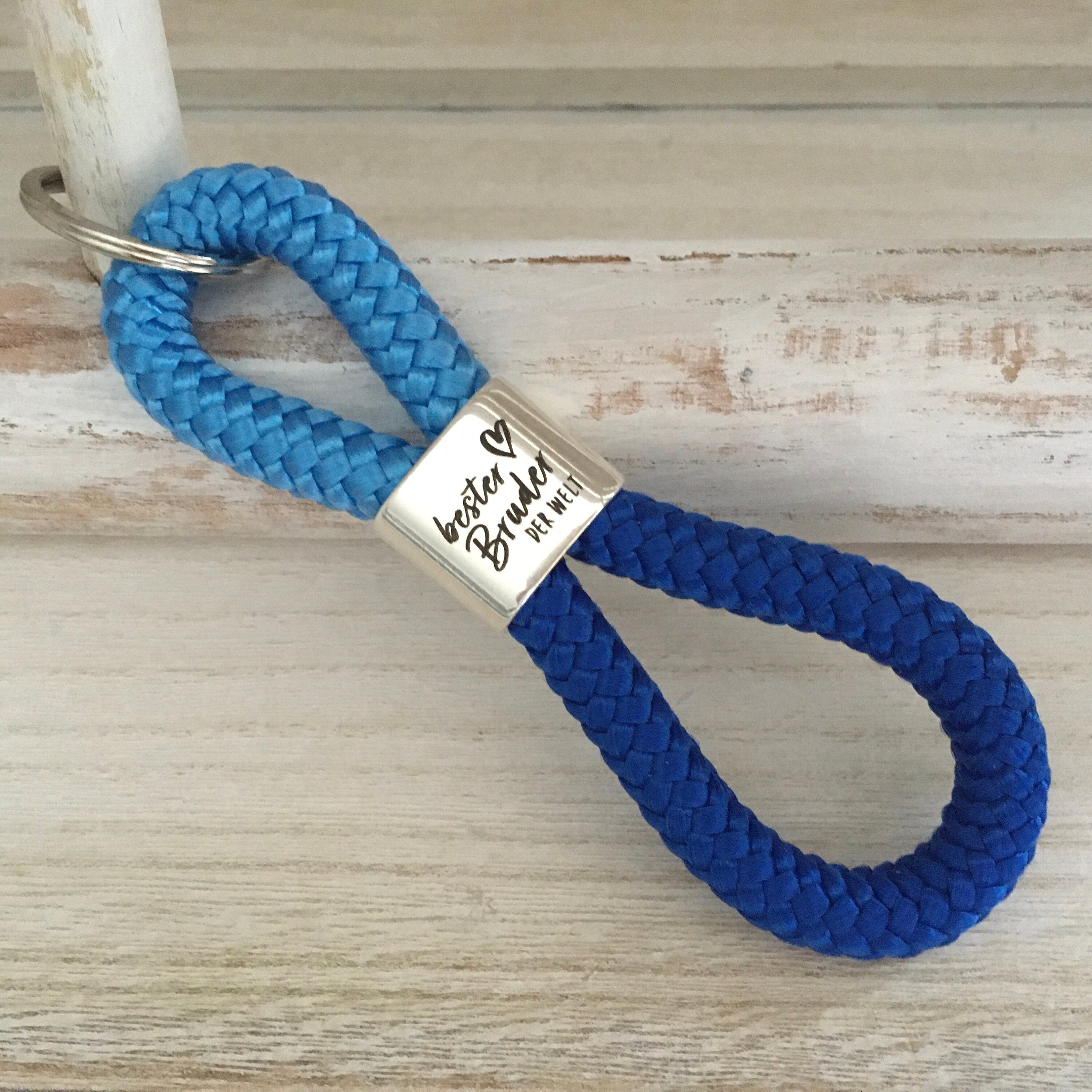 Schlüsselanhänger aus Segelseil mit versilbertem Zwischenstück mit Gravur "Bester Bruder der Welt", himmelblau/ blau