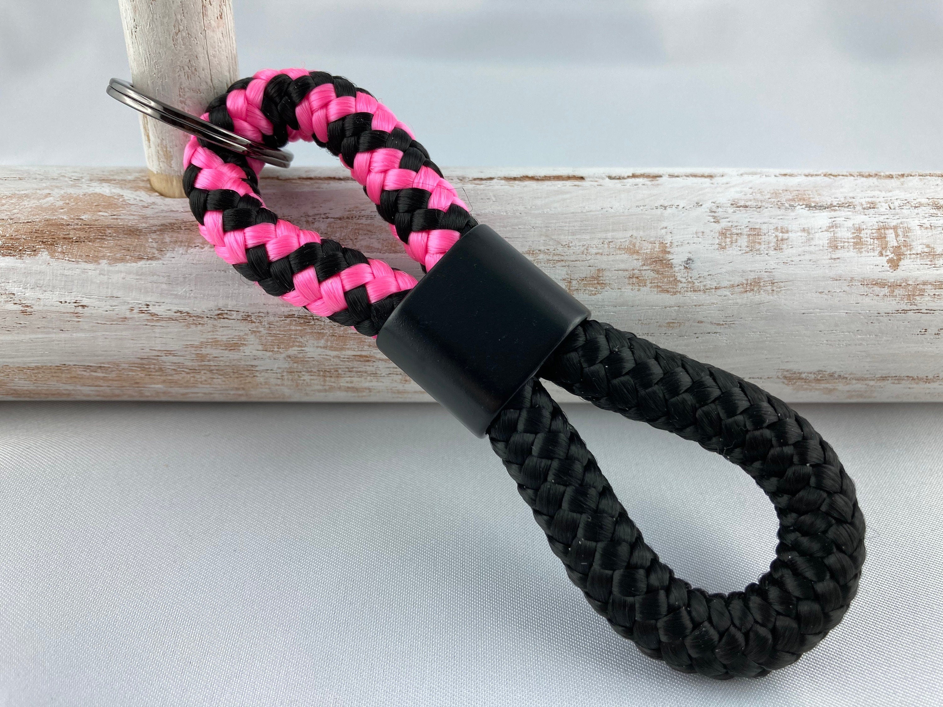 Schlüsselanhänger aus Segelseil mit schwarzem Zwischenstück matt, schwarz-pink/ schwarz