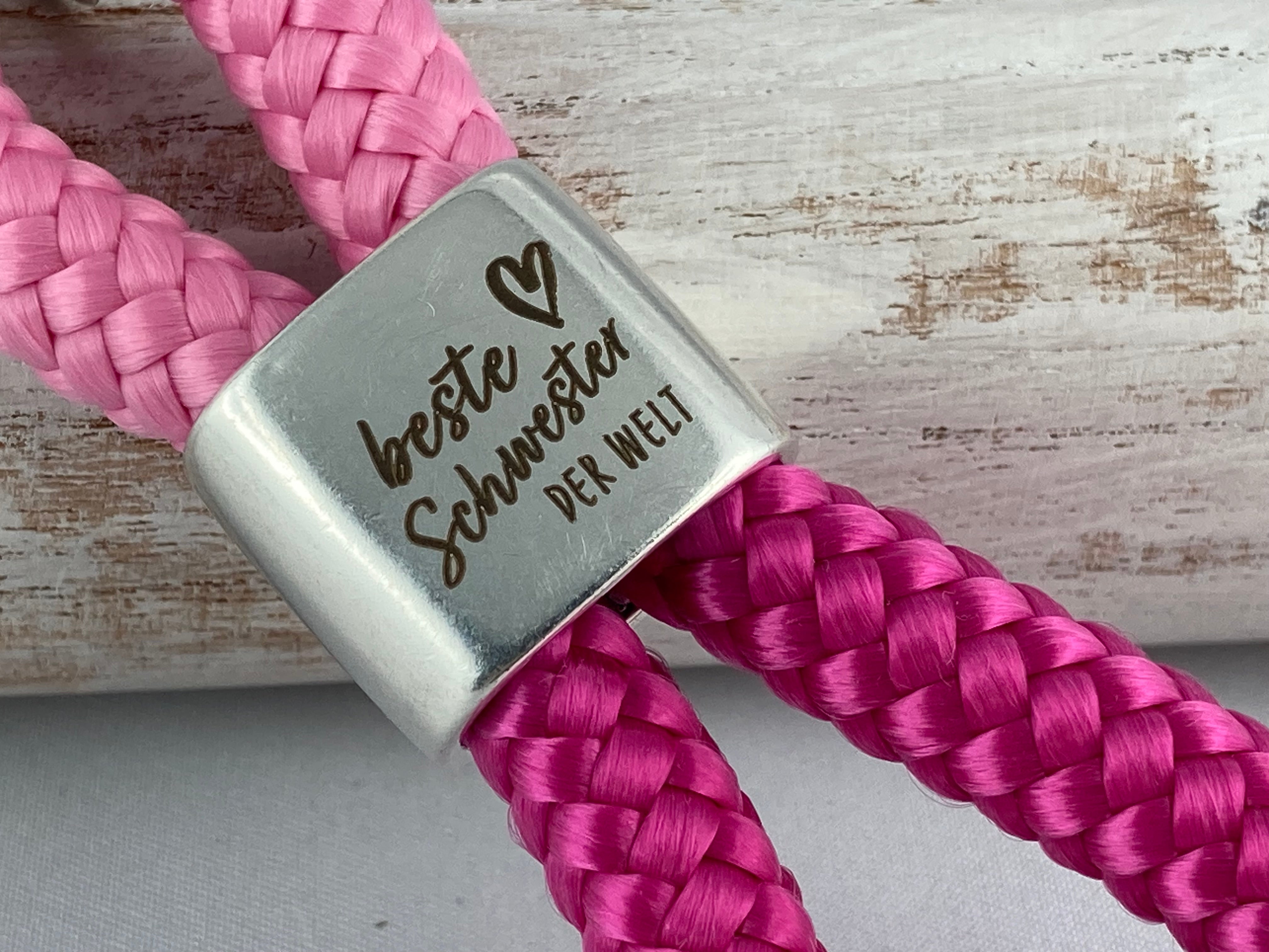 Schlüsselanhänger aus Segelseil mit Gravur "Beste Schwester der Welt" - rosa/ fuchsia