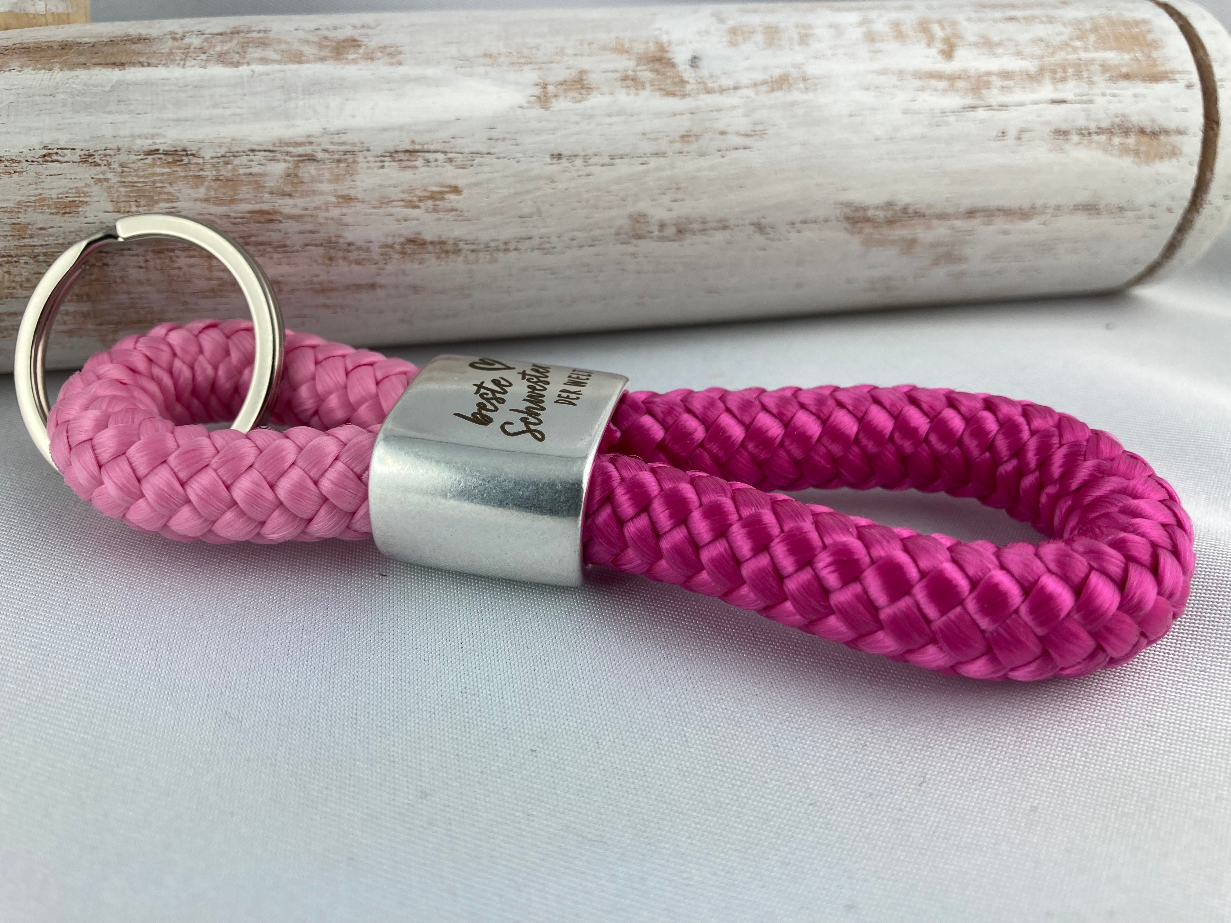 Schlüsselanhänger aus Segelseil mit Gravur "Beste Schwester der Welt" - rosa/ fuchsia