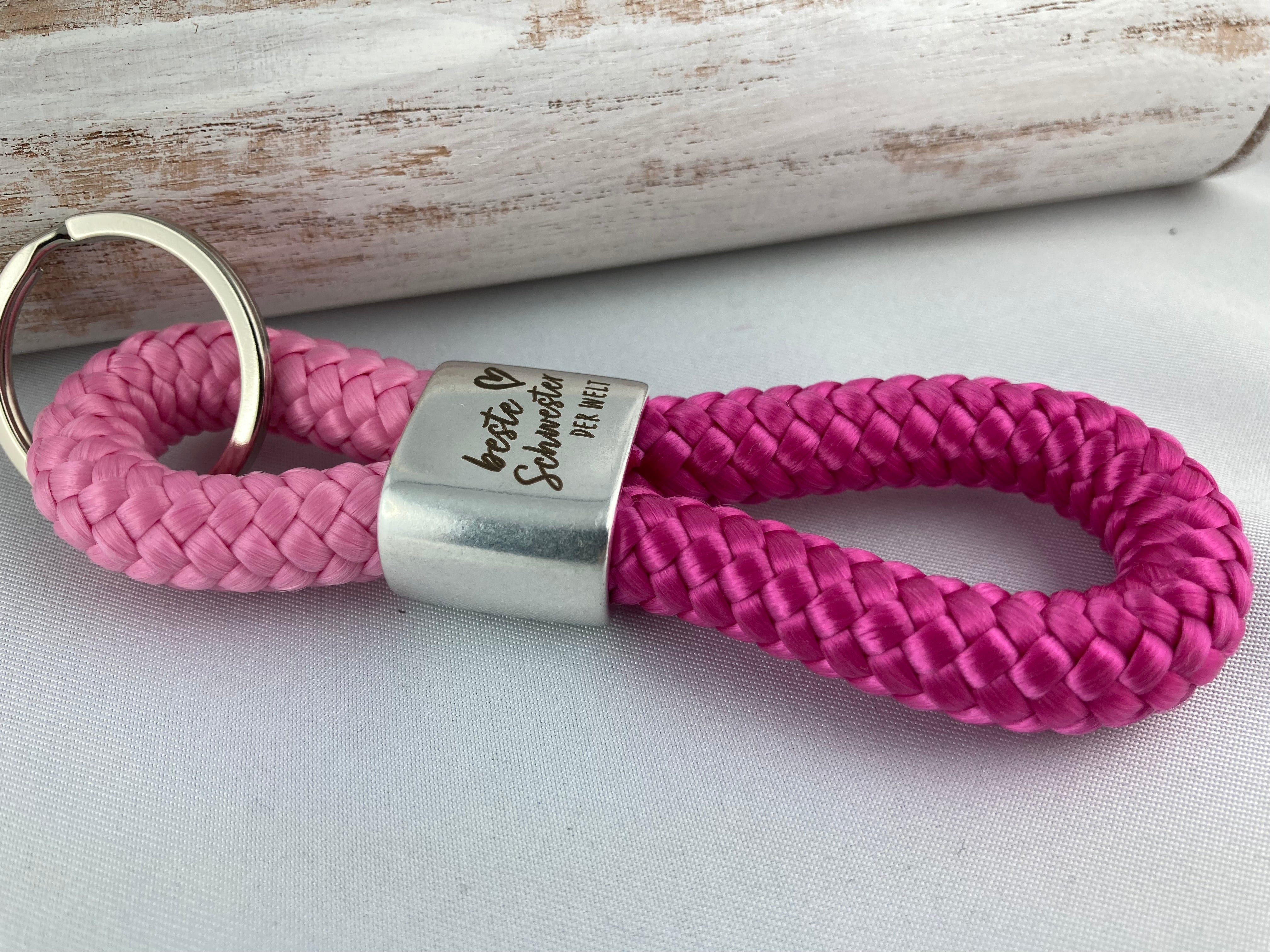 Schlüsselanhänger aus Segelseil mit Gravur "Beste Schwester der Welt" - rosa/ fuchsia